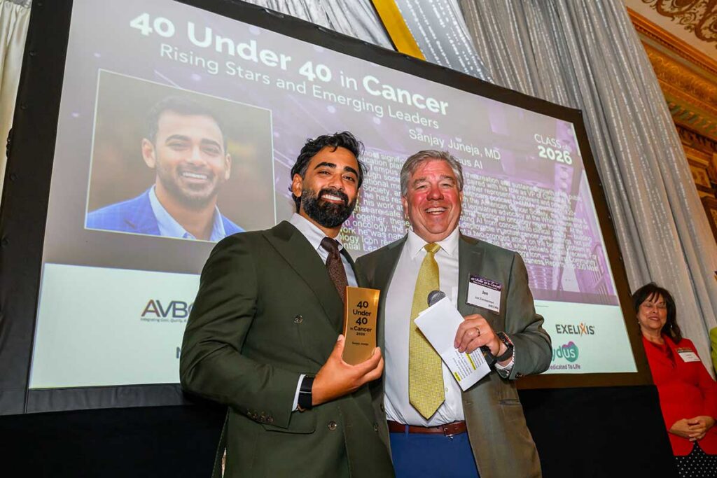 Jon Zimmerman and Sanjay Juneja, award recipient